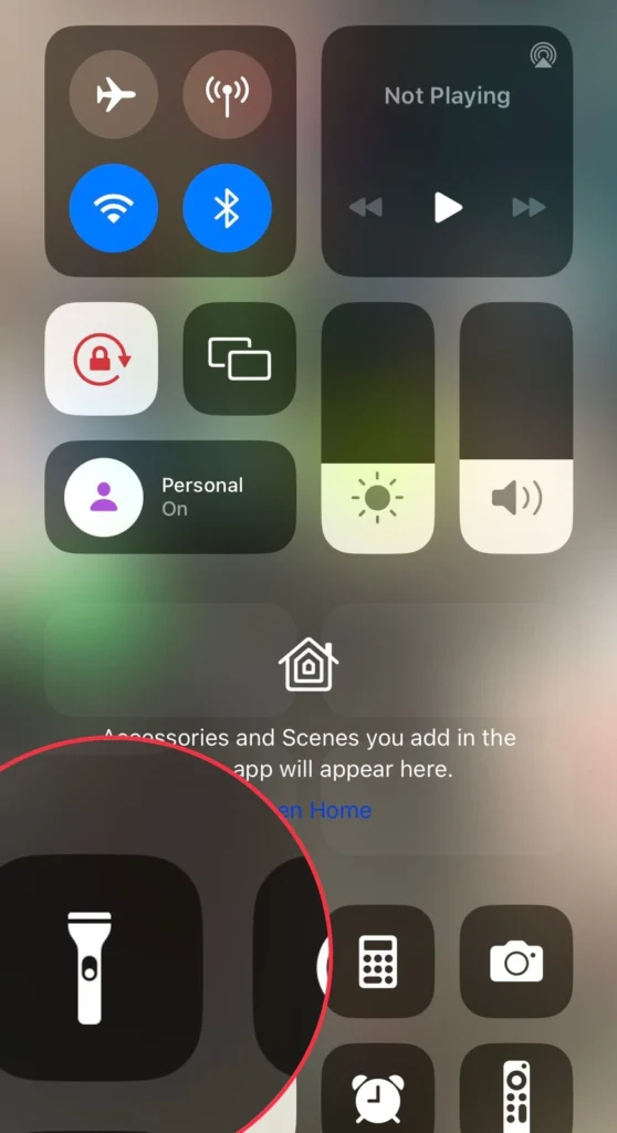Press and hold onto the Torch icon in the control centre menu.